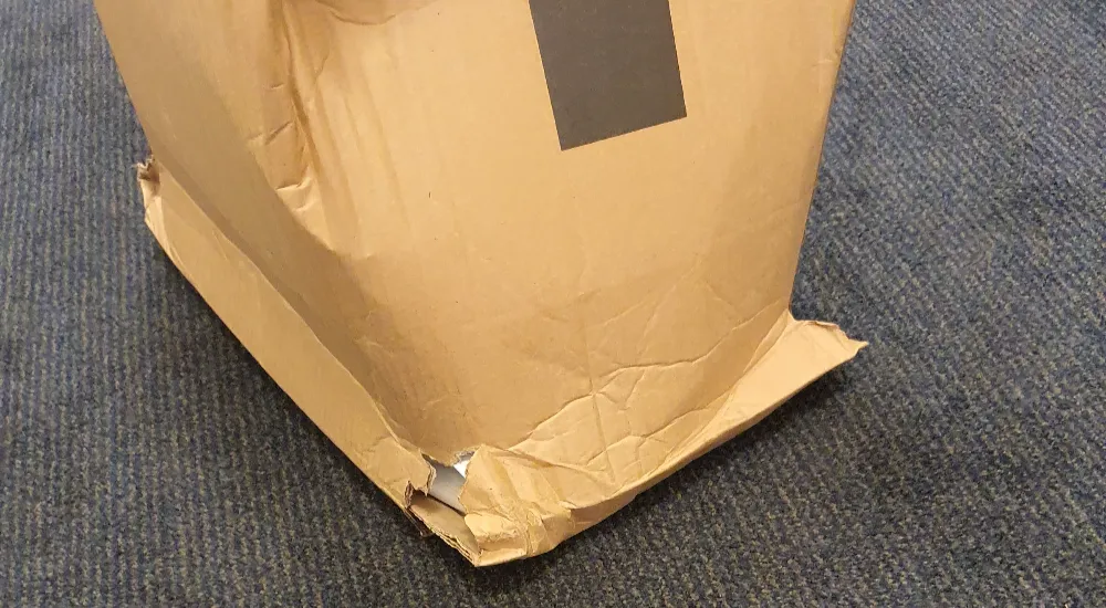 Standard paperboard scuffed. It dented on the corners.