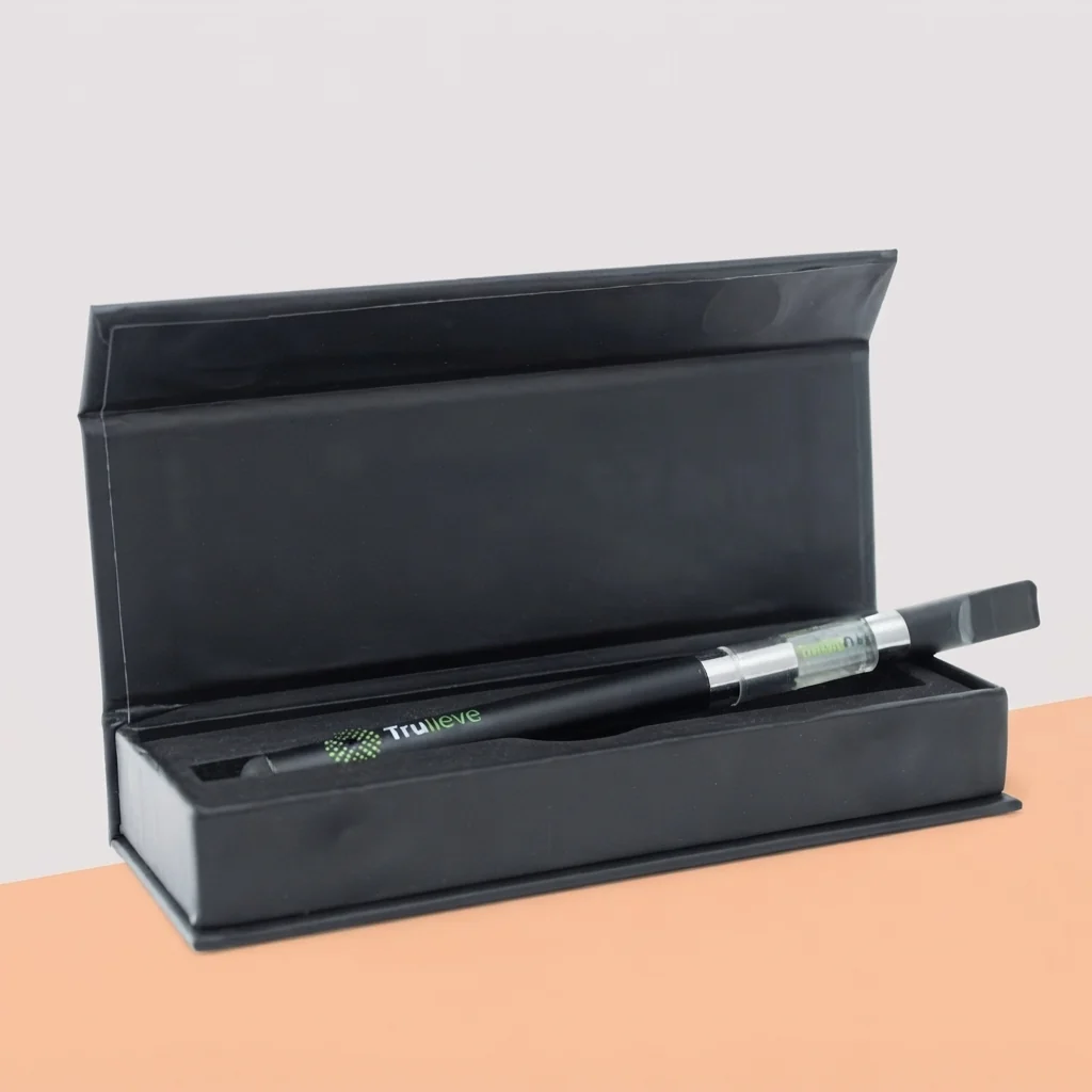 A long pen beside its flat printed carton
