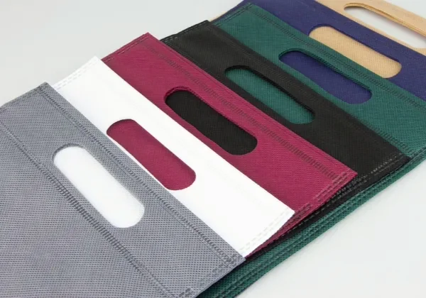 A paper bag with a handle cut directly from its own top panel