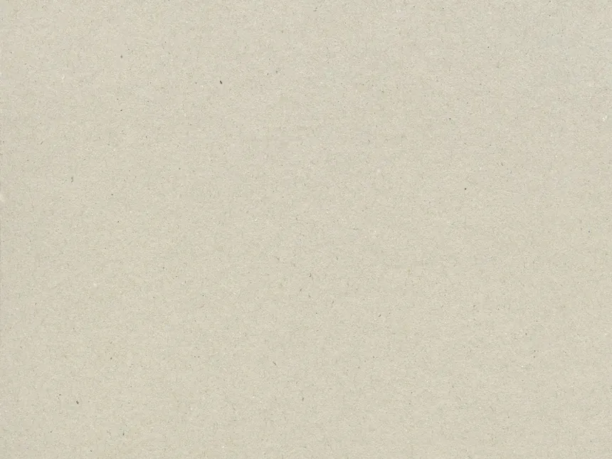 A smooth cream coated paper surface in raking light