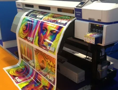 A wide-format digital press printing a full-colour banner