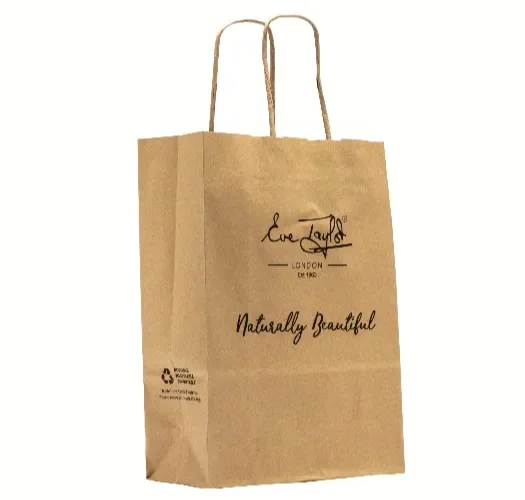 A kraft carrier bag with twisted handles printed with a botanical illustration
