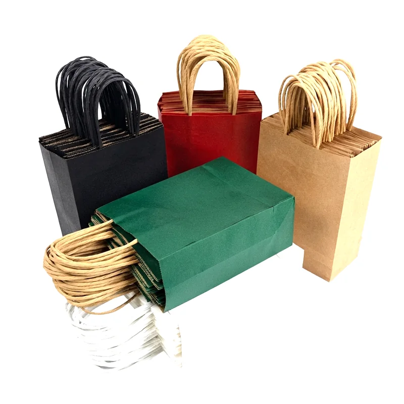A stack of printed paper bags in black, red, green and kraft with loop handles