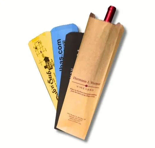 Three kraft bottle bags of different sizes lying beside each other