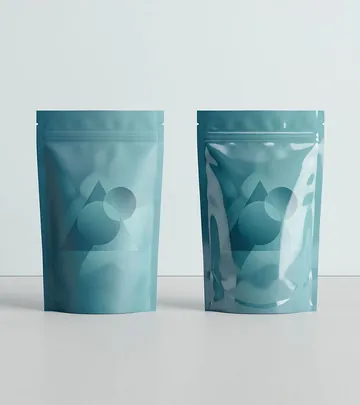 Two glossy marbled stand-up pouches catching the light