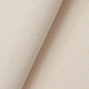 Folded natural cotton canvas showing a dense woven surface