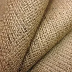 Folded natural jute burlap showing a coarse woven plant fiber