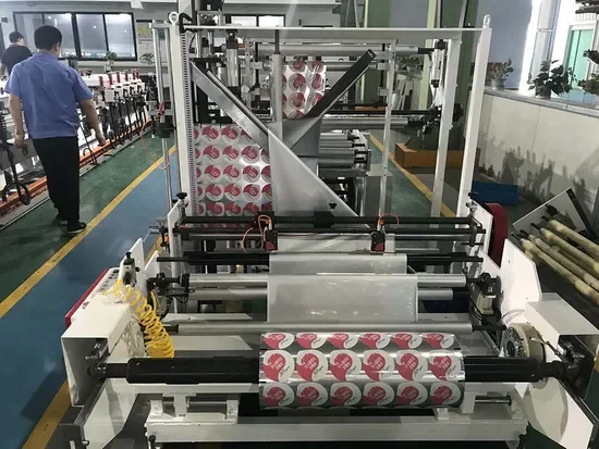 A roll laminating line running printed film onto woven fabric in the factory
