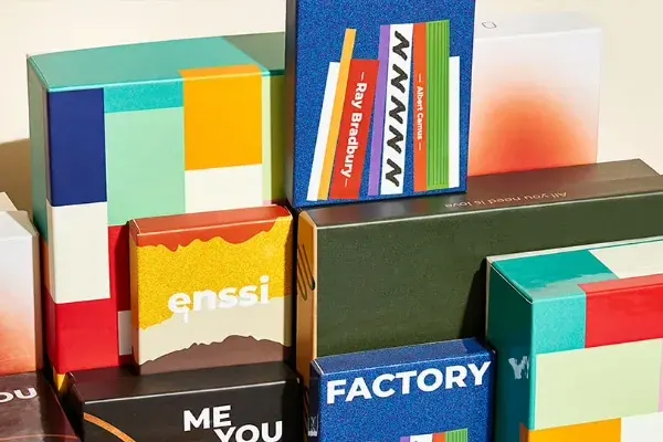 A colourful stack of printed rigid boxes from several brands