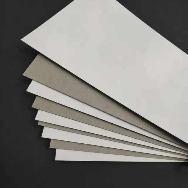 A thick greyboard slab beside a rigid gift box